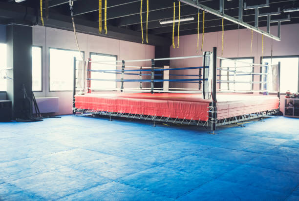 Empty Boxing Ring in healthy club gym Empty Boxing Ring in healthy club gym boxing ring stock pictures, royalty-free photos & images