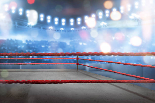 Empty boxing ring with red ropes for match Empty boxing ring with red ropes for match in the stadium arena boxing ring stock pictures, royalty-free photos & images