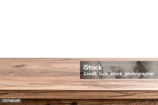 istock Empty brown wooden table top isolated on white background 1317485281