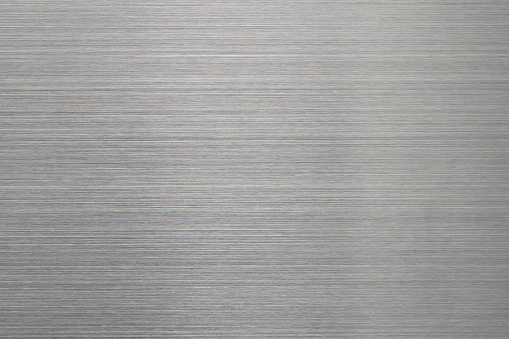 Empty brushed metal surface. Abstract background for design and backdrop.