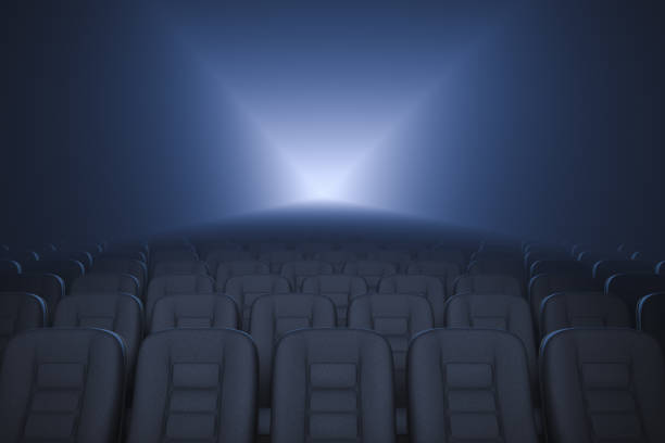 Empty cinema. Working movie projector in background. stock photo