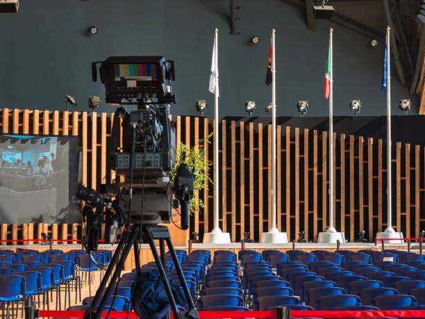 Empty Conference Room with Television Camera Ready for Audience Empty Conference Room with Television Camera Ready for Audience congressional country club stock pictures, royalty-free photos & images