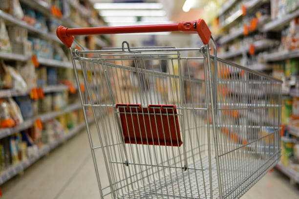 empty food aisles for fear of coronavirus at the supermarket cart photos stock pictures, royalty-free photos & images
