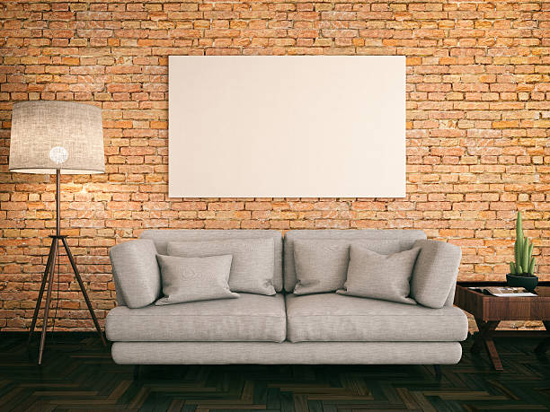Empty Frame with Couch Cozy couch and empty picture frame on brick wall living room photos stock pictures, royalty-free photos & images