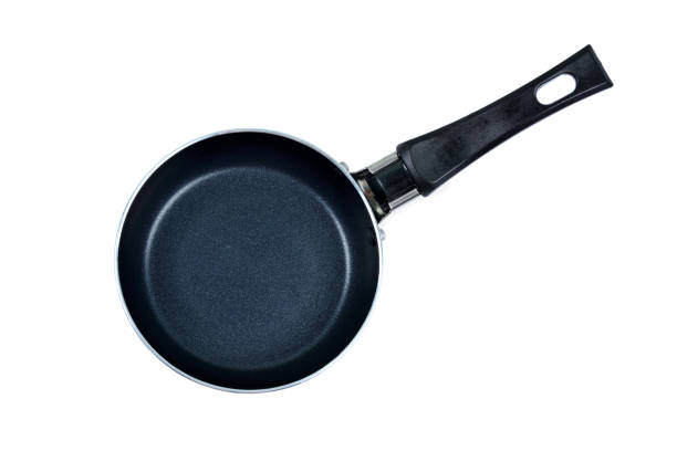 Empty iron pan on white background stock photo