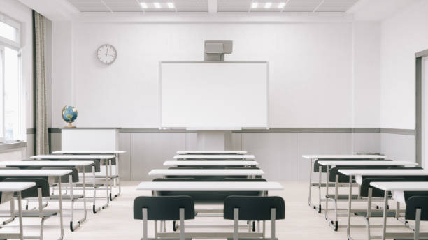 Empty Modern Classroom With Interactive Whiteboard (World Map Credits To NASA) Interior of an empty modern classroom with interactive whiteboard. lecture hall stock pictures, royalty-free photos & images