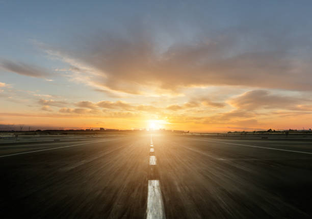 Empty motorway with sunset Empty motorway with sunset. Outdoor photography. Travel and sport, speed and freedom concept airport runway stock pictures, royalty-free photos & images