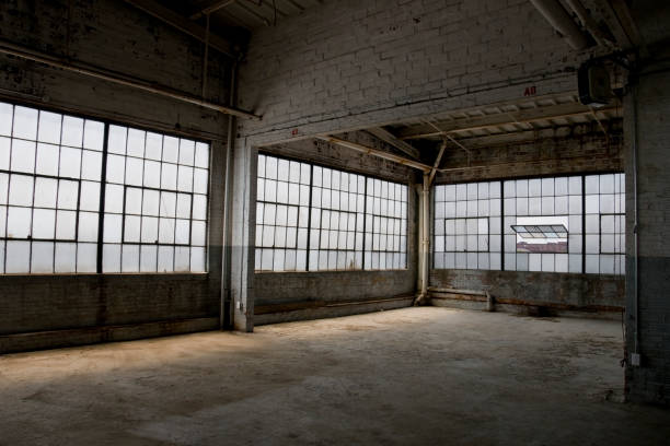Empty, old, abandoned factory warehouse stock photo