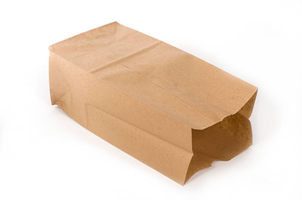 empty paper lunch bag on its side - brown paper bag bildbanksfoton och bilder