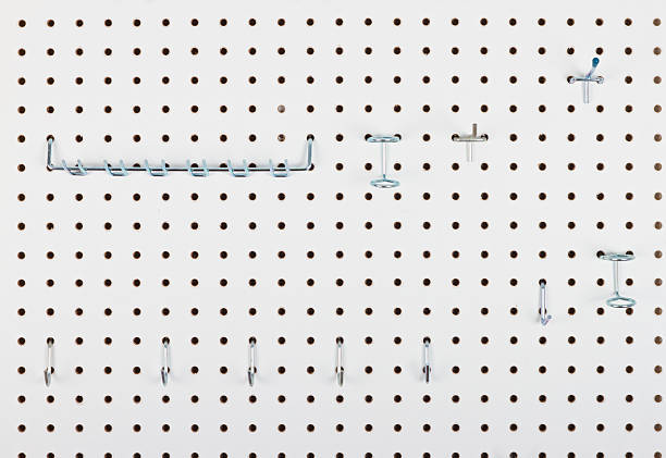 Empty Pegboard With Hooks For Organizing Empty Pegboard With Hooks For Organizing, close up pegboard stock pictures, royalty-free photos & images