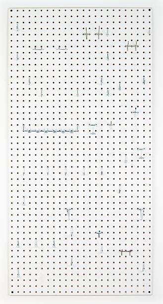 Empty Pegboard With Hooks For Organizing Empty Pegboard With Hooks For Organizing pegboard stock pictures, royalty-free photos & images
