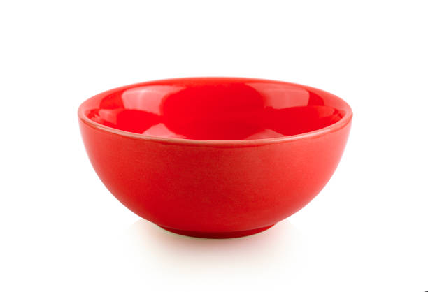 Empty red bowl on white background stock photo