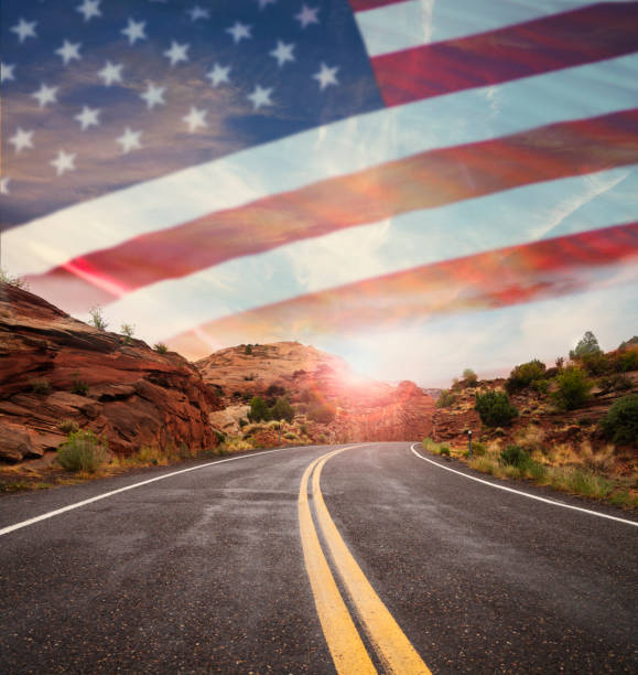 Empty road and american flag in sky stock photo