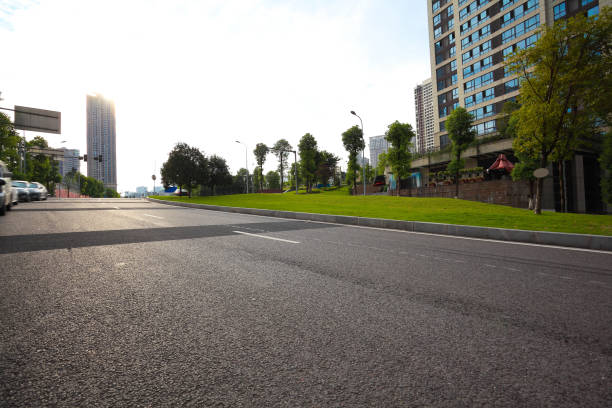 Empty road surface floor with City streetscape buildings stock photo