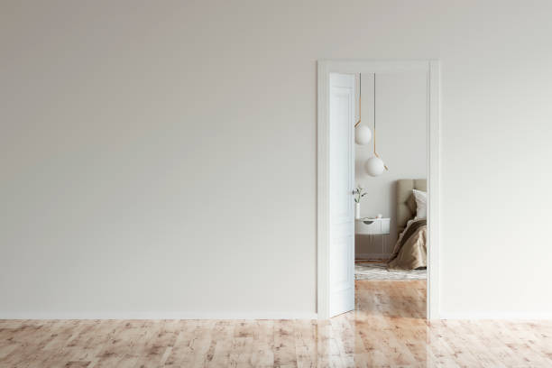 empty room with an open door to a beige modern bedroom. - door imagens e fotografias de stock