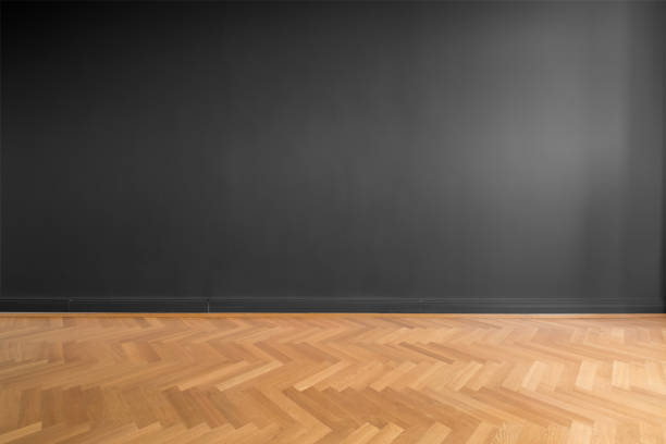 empty room with black wall background and wooden parquet floor empty room with black wall background and wooden parquet floor parquet floor stock pictures, royalty-free photos & images