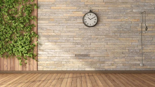 Empty room with climbing plants, wooden panel and stone wall stock photo