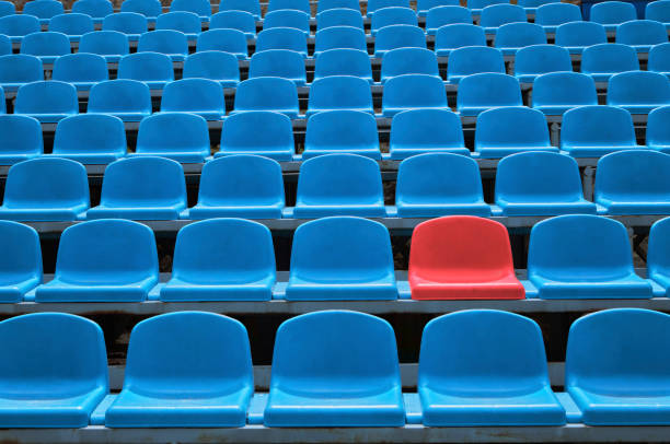 Empty seats in a stadium with one special stock photo