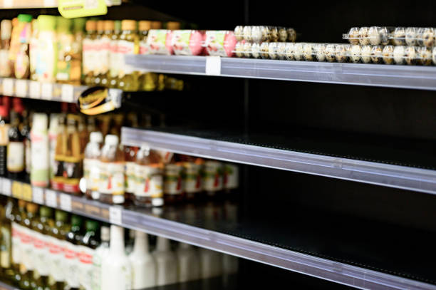 Empty shelves in a grocery store, Hoarding food stock photo