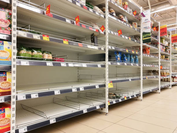 KAUNAS, LITHUANIA - FEBRUARY 29, 2020: Empty shelves in a Maxima supermarket. Shortages of goods during panic of Corona virus. stock photo