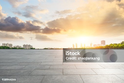 istock empty square and modern city scenery at sunset 938944544