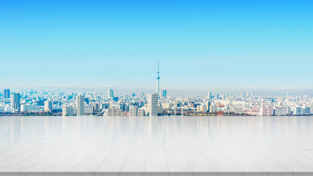 empty stone panel ground with panoramic city skyline in Tokyo, Japan Business and design concept - empty stone panel ground with panoramic city skyline aerial view under bright sun and blue sky of Tokyo, Japan for mockup or montage product tokyo sky tree stock pictures, royalty-free photos & images