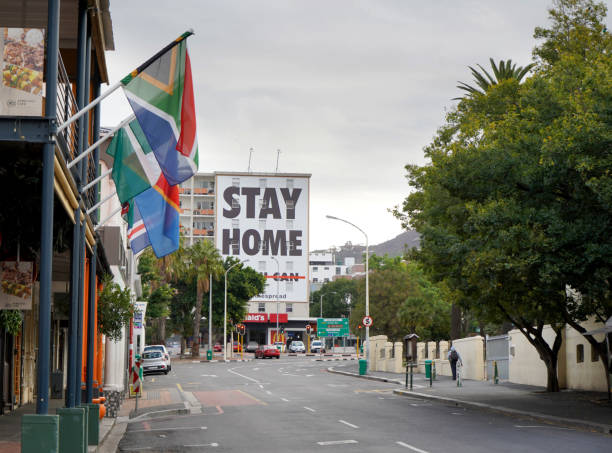 Empty streets and a stay home sign in Cape Town during the Coronavirus lockdown Cape Town, South Africa - 6 April 2020 : Empty streets and stay home sign in Cape Town during the Coronavirus lockdown south africa covid stock pictures, royalty-free photos & images