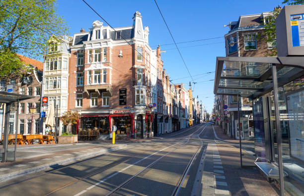empty streets in amsterdam - amsterdam street imagens e fotografias de stock