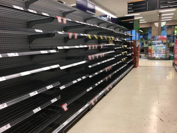 Empty supermarket shelving stock photo