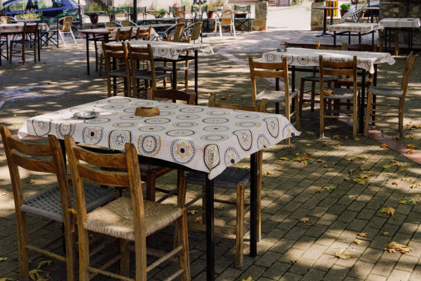 Empty tavern outdoors seating area in Greece. stock photo