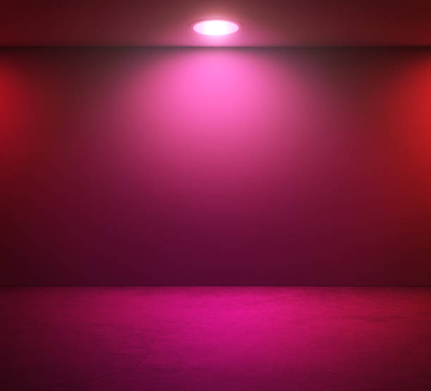 Empty wall and pink spotlight in room stock photo