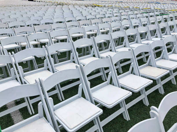 Empty White Chairs For Graduation stock photo