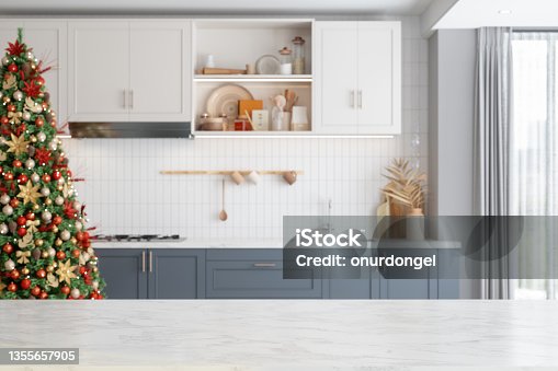 istock Empty White Marble Surface And Blurred Kitchen With Christmas Tree 1355657905