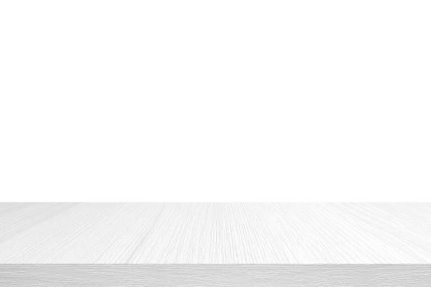 Empty white wooden table top, desk isolated on white background, Wood table surface for product display banner, White counter, shelf  for food display backdrop stock photo