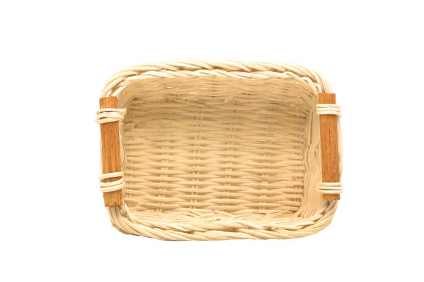 Empty wicker basket, wooden fruit or bread basket on white background in top view stock photo