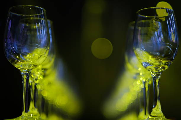 Empty wine glasses on color background stock photo