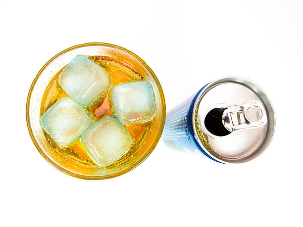 Energy drink can with full glass stock photo