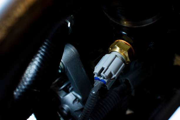Engine sensor an installed on a car engine. stock photo