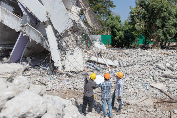 Engineer architect and worker operation control demolish old building. Engineer architect and worker operation control demolish old building. collapsing stock pictures, royalty-free photos & images