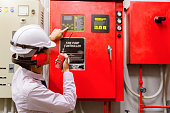 istock Engineer checking Industrial fire control system,Fire Alarm controller, Fire notifier, Anti fire.System ready In the event of a fire. 949716894