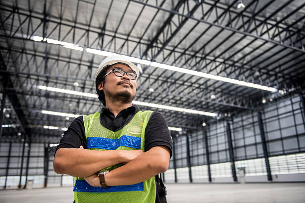 Engineer working and standing in new warehouse stock photo