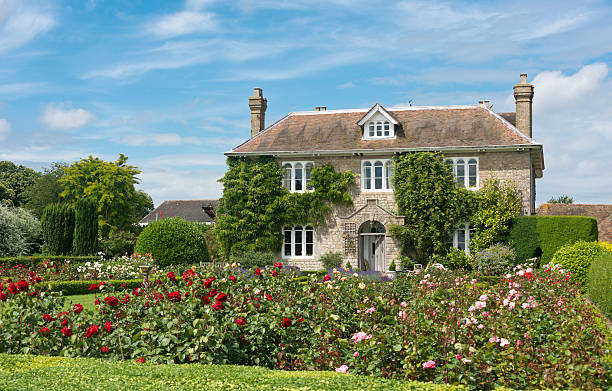 English Country Cottage A Picturesque English country cottage with rose garden, located in an English Village. cottage stock pictures, royalty-free photos & images
