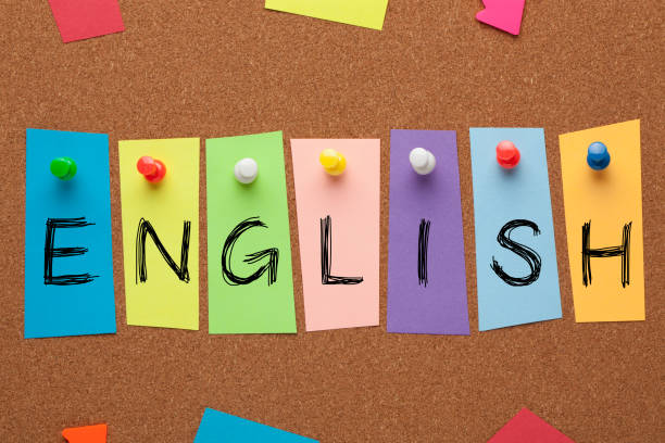 English Word Concept English word written in colorful stickers pinned on cork board. Learning languages concept english language stock pictures, royalty-free photos & images
