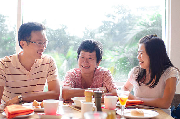 Malaysian Family Dining Stock Photos, Pictures & Royalty-Free Images