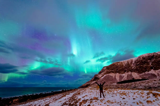 Enjoying the Northern Lights in Unstad stock photo