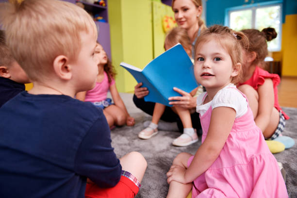 Enjoying time spent together Enjoying time spent together teach reading to kindergarteners stock pictures, royalty-free photos & images