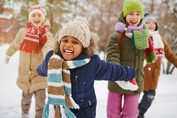 Enjoying winter day Cheerful girl and her friends spending time outdoors winter stock pictures, royalty-free photos & images