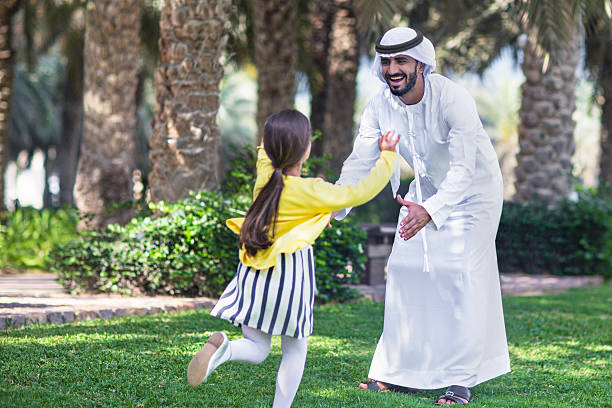 Enjoying with her father Middle Eastern daughter running to the arms of her father. agal stock pictures, royalty-free photos & images