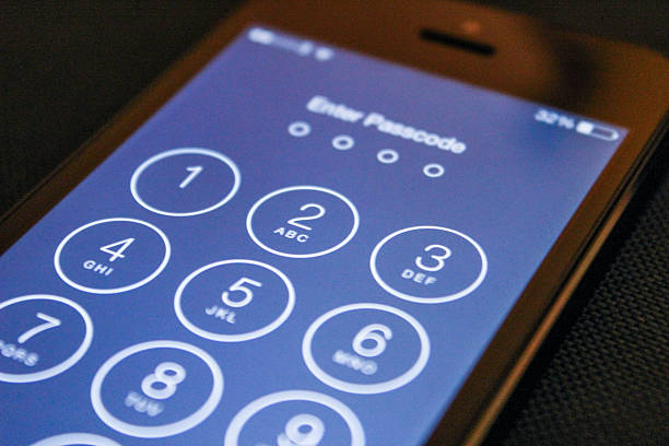 Enter passcode on the iOS 8 iPhone 5 stock photo