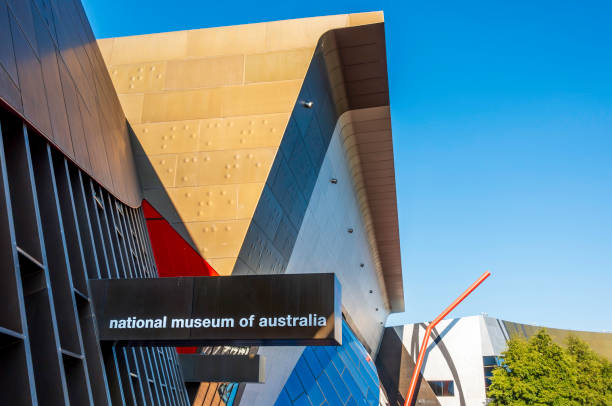 Entrance sign in shadow of the iconic National Museum of Australia, Canberra stock photo